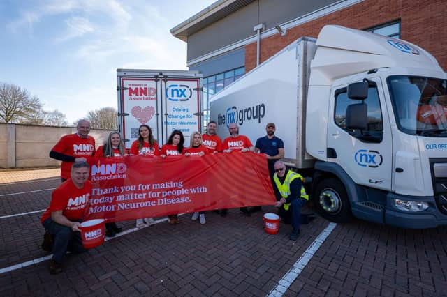 The team from NX Group unveil new branding on their lorries to help raise awareness of motor neurone disease and the work of the MND Association.