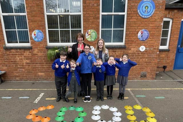 Liz Crofts (Executive Headteacher), Rebecca Dunkley (Head of School) and children from Spratton Primary School celebrating their 'Good' Ofsted inspection result. 