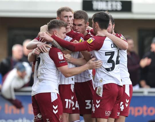 Northampton Town are predicted to have a three way battle for automatic promotion with just two goals separating the teams.