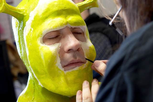 UON students apply prosthetics for Shrek The Musical.
