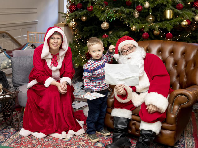 Children meet Father Christmas at Delapre Abbey in December 2022.