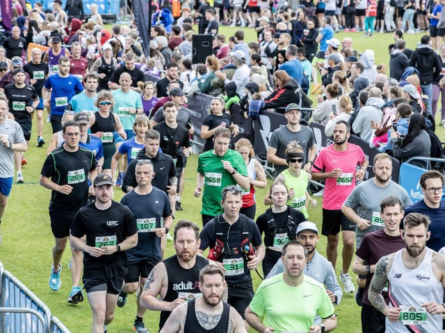 Hundreds of runners braved showers and wind to take on the race on Sunday (May 25), which started and finished at Sixfields stadium.