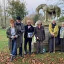 Members of the Northamptonshire Gardens Trust at the impressive statue of the riderless horse in the Billing Road Cemetery