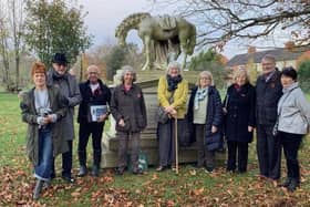 Members of the Northamptonshire Gardens Trust at the impressive statue of the riderless horse in the Billing Road Cemetery
