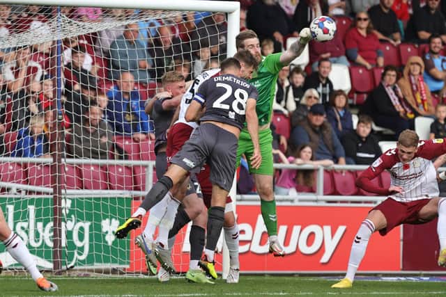 Lee Burge punches clear under pressure against Newport County (Picture: Pete Norton)