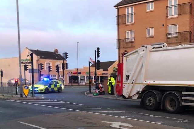 Police and paramedics were at the scene of a collision between a bin lorry and a mobility scooter in Northampton on Friday morning