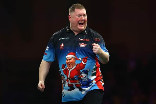 Ricky Evans celebrates a set victory during his 3-2 win over Australian Gordon Mathers at Alexandra Palace on Wednesday