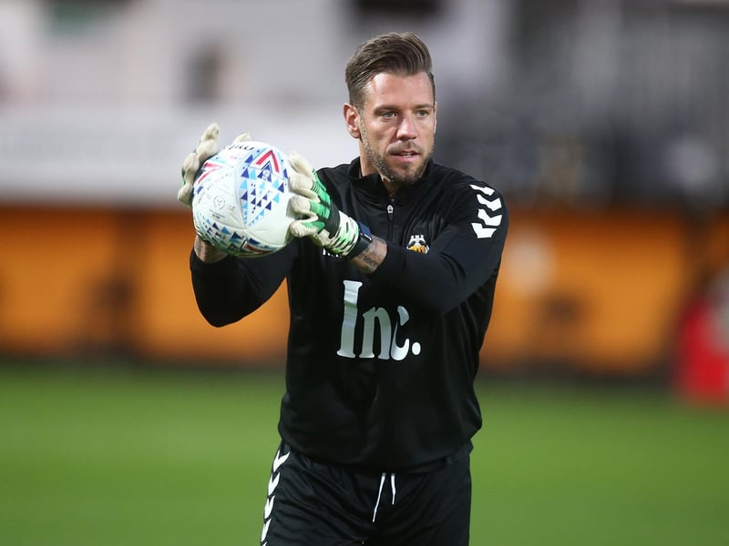 Goalkeeper coach Mark Bunn, picture here in action during the pre match warm up prior to the Leasing.Com Trophy match between Cambridge United and Northampton Town at Abbey Stadium on October 08, 2019 in Cambridge. Bunn played for Northampton Town between 2001 and 2008. (Photo by Pete Norton/Getty Images)