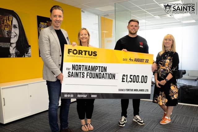 Fortus present the cheque for £1,500 to Northampton Saints Foundation