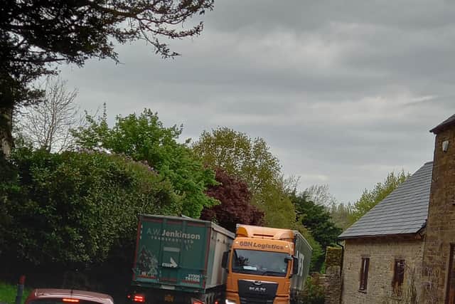 Passing lorries stuck at the pinch point in the village, on an acute bend towards Banbury. Credit: Farthinghoe Parish Council