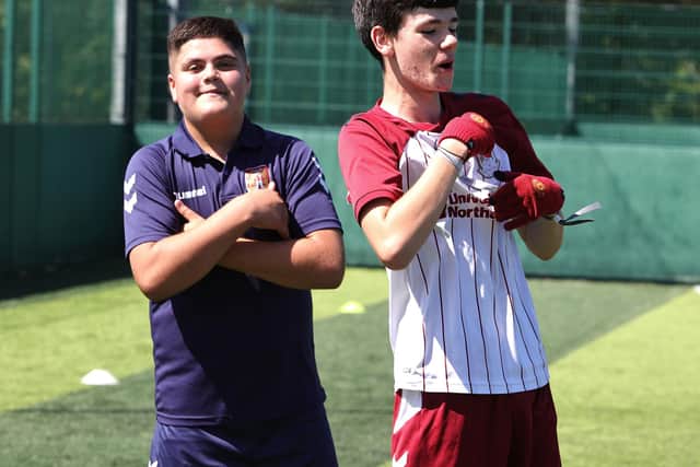 Users having fun at a disability football coaching session
