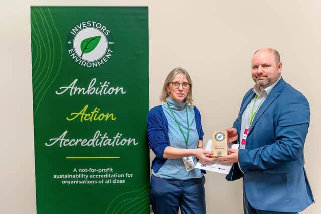 NGH’s Head of Sustainability, Clare Topping, is presented with the award by Stuart Dawks, Chief Executive of the Peterborough Environment City Trust, the environmental charity that own and manage the Investors in the Environment Scheme.
