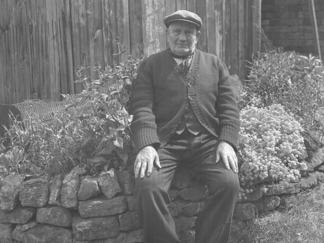 June 4, 1962 - Old man sitting on a stone wall