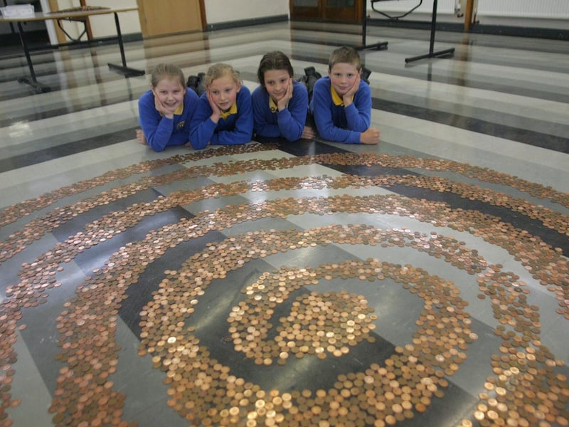 Headlands Primary School pupils were collecting 1p and 2p copper coins to make a pattern with in the school hall (and pyramids). L_R are Emily Ashby, Eliza Pawley, Charlotte Hewitt and Jon Henson all aged 10