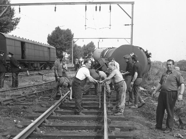 Rail gang repairing track after derailment in the mid-1960s