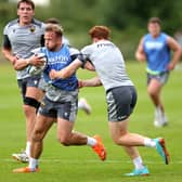 Tom Cruse on the charge in pre-season training (photo by David Rogers/Getty Images)