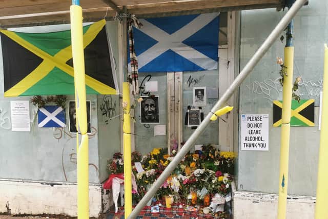 Tributes and flowers have been left in a doorway in Abington Street where George used to sit