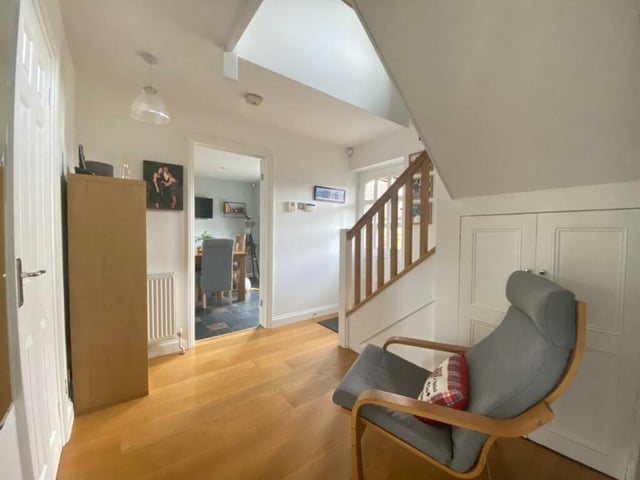 A welcoming hallway leads to the reception rooms on the ground floor and the bedrooms upstairs