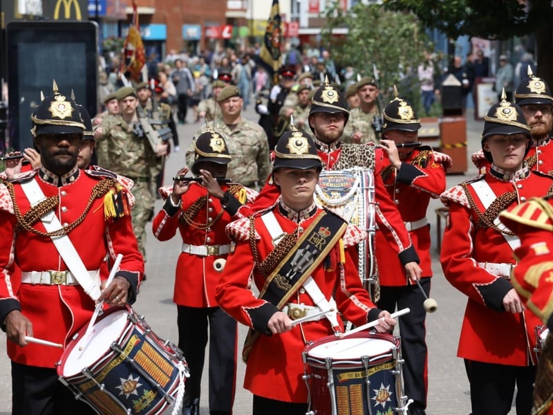 Kettering town centre: crowds line town centre to welcome The Royal Anglian Regiment for Armed Forces Day parade /National World