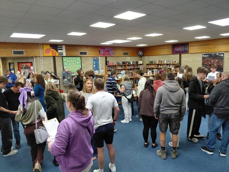 Students opening results in eager anticipation