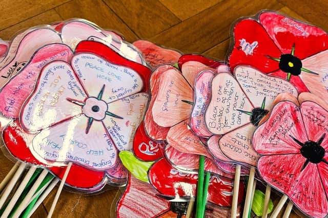 Elm Bank Care Home residents join the children from St Thomas More Catholic Primary School for an Armistice Day Service