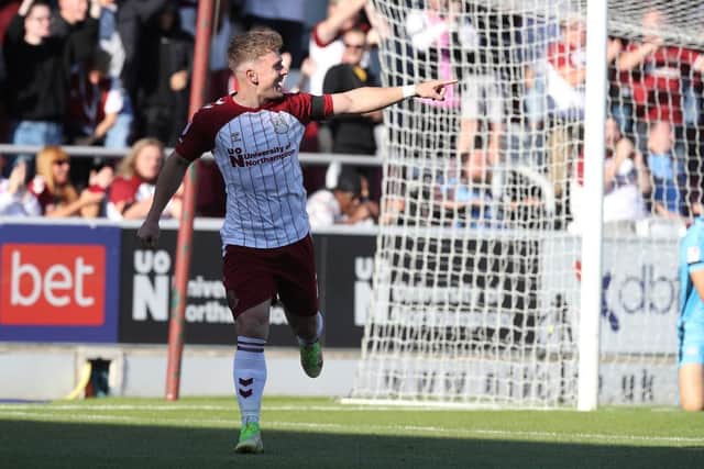 Cobblers attacker Sam Hoskins celebrates after scoring his second and his side's third against Rochdale (Picture: Pete Norton)