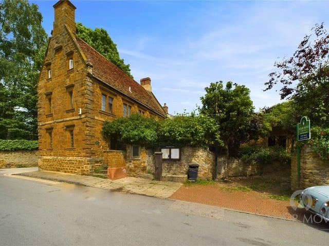 The property makes an eye-catching impression from the high street with its rustic masonry and pointed roof