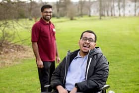 Patient Jovel (right) with Specialist Physiotherapist Binny said music gave him hope 