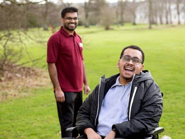 Patient Jovel (right) with Specialist Physiotherapist Binny said music gave him hope 
