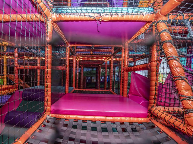 There is a new sensory room, car wash role play zone, two large ball pits with ball showers, and a sports court with astroturf on the top level.