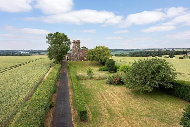 A grand driveway is surrounded by the beautiful Northamptonshire countryside