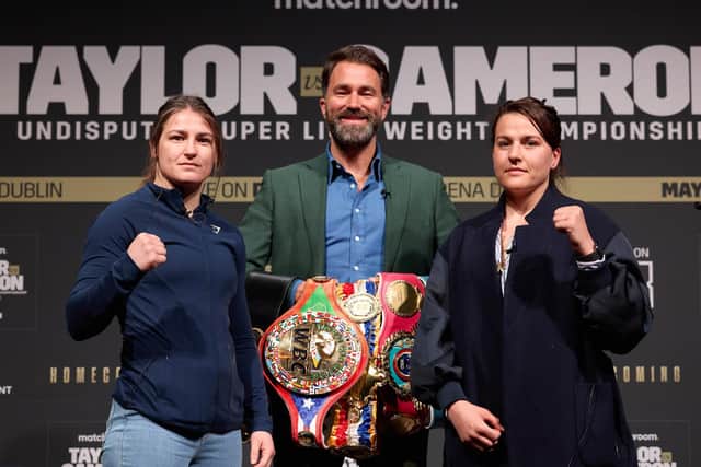 Katie Taylor and Chantelle Cameron face the cameras with Matchroom Boxing boss Eddie Hearn (Picture: Mark Robinson Matchroom Boxing)