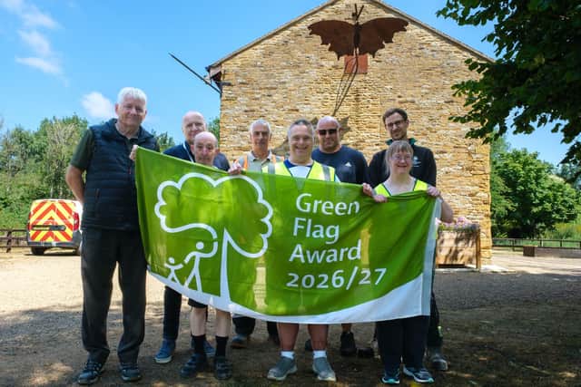 Cllr Nigel Stansfield – Cabinet Member for Environment, Recycling and Waste (back row, second left) is pictured with representatives from West Northamptonshire Council and LIVE volunteers at Bradlaugh Fields Park (front holding the flag).