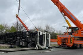 engineers used a huge crane to lift an overturned HGV on the A14 near Rothwell on Monday night. Photo: @Northants_RCT