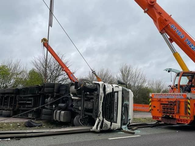 engineers used a huge crane to lift an overturned HGV on the A14 near Rothwell on Monday night. Photo: @Northants_RCT