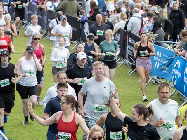 Hundreds of runners braved showers and wind to take on the race on Sunday (May 25), which started and finished at Sixfields stadium.