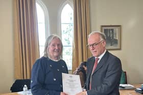SSAFA’s Sue Walters receiving her award from HM Lord Lieutenant James Saunders-Watson