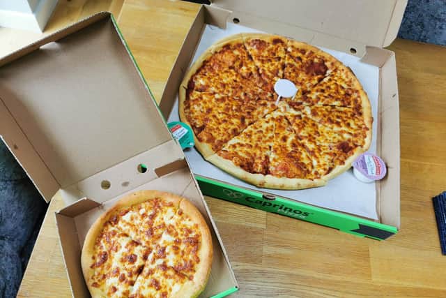 A large Caprinos pizzaa and a side order of garlic bread