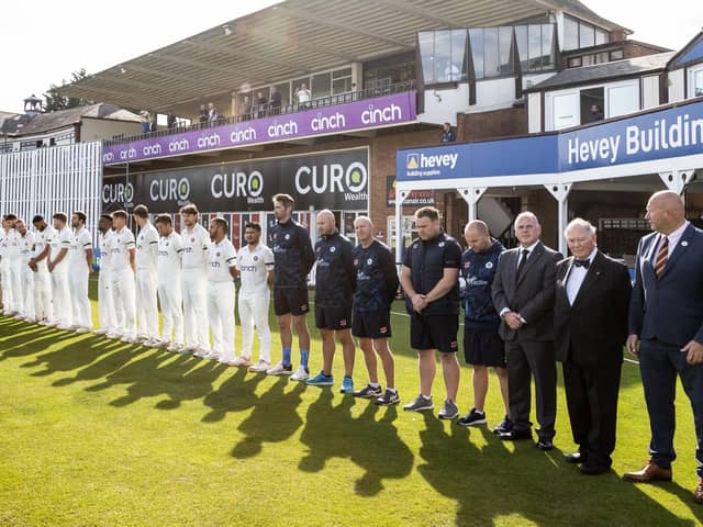 Northants and Surrey players and officials pay their respects to the late Queen Elizabeth II during a minute's silence ahead of play in the LV= Insurance County Championship Division One match at the County Ground (Picture: Andy Kearns/Getty Images)