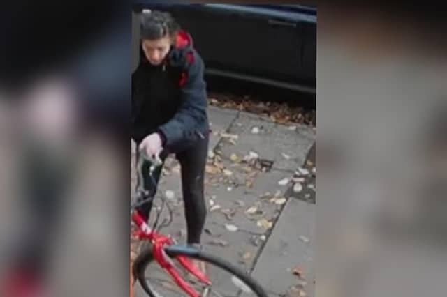 Police would like to speak to the woman in the image.