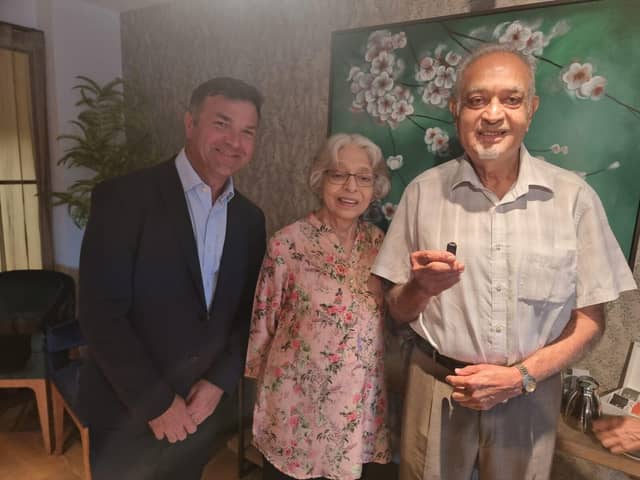 Jamie Bunce CEO with residents Mrs and Mr Gadhir