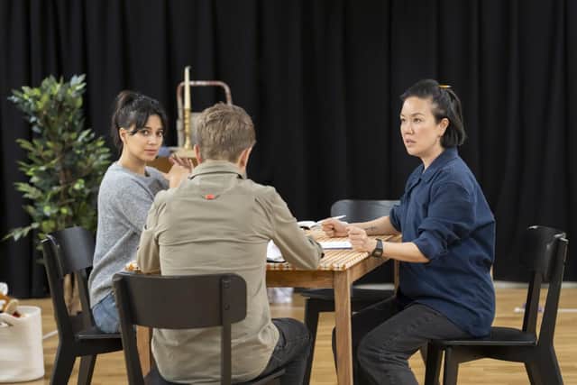 Fiona Wade, George Rainsford and Vera Chok in rehearsal for 2:22. Photo by Johan Persson