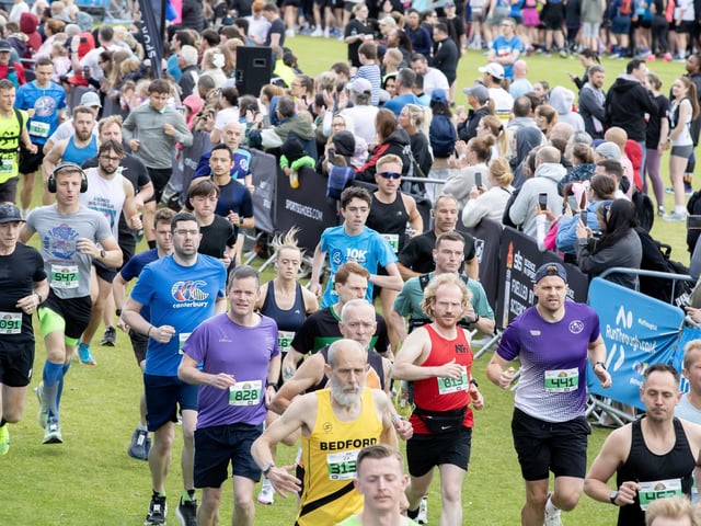 Hundreds of runners braved showers and wind to take on the race on Sunday (May 25), which started and finished at Sixfields stadium.