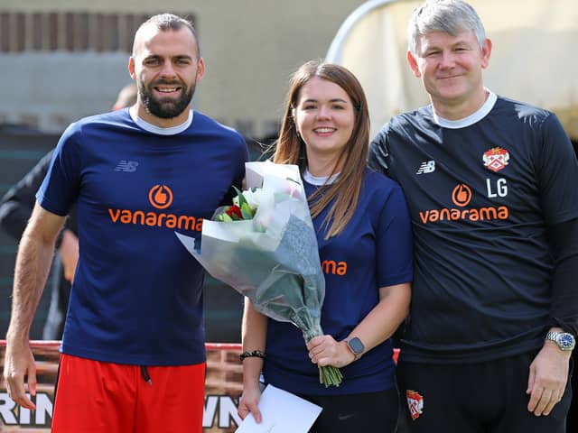 Manager Lee Glover and captain Gary Stohrer made a special presentation to sports therapist Rachel Birks as she leaves Kettering Town to take on a full-time role at Northampton Saints. Picture by Peter Short