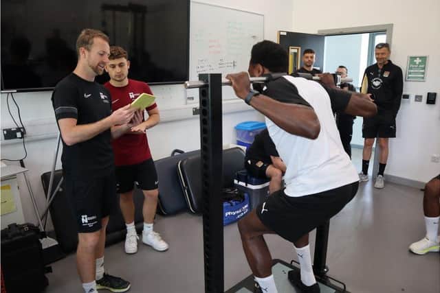 University of Northampton staff and student evaluate NTFC players at Waterside campus.