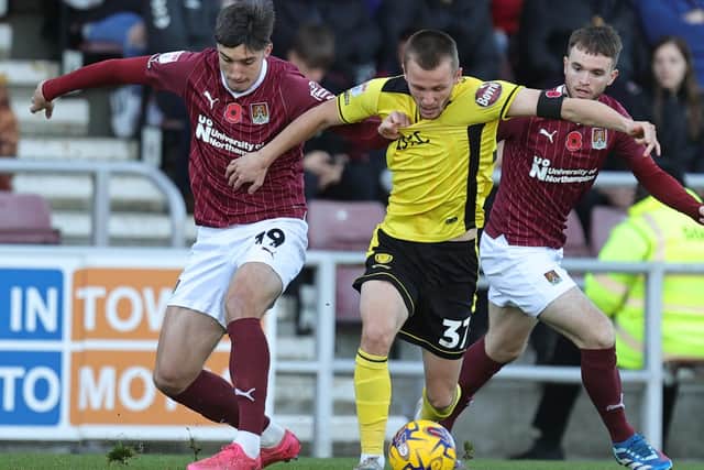 Kieron Bowie battles for possession in the Cobblers' clash with Burton Albion at Sixfields (Picture: Pete Norton)