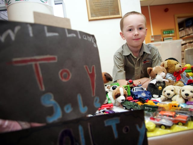 William Edwards holding a Toy Sale in The Oncology Centre, Northampton General Hospital, to raise money for the department.