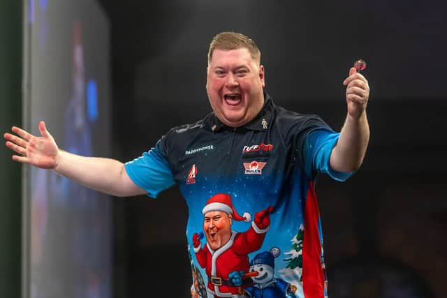 Ricky Evans celebrates his dramatic win over Dave Chisnall (Picture: Simon O'Connor)