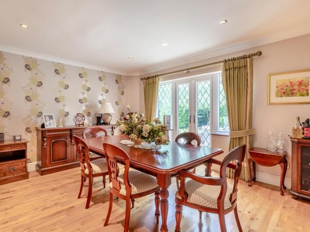 The quaint dining room has space for all the family as well as French doors leading to the garden