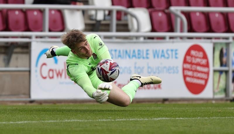 Lee Burge makes a good save from Abu Kamara